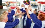 All eyes on the bouquet: Members of Unity Gospel Choir launch the event at the Milk Market Picture: Michael Cowhey