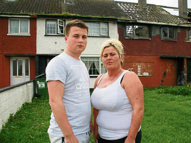 Son and mother, Dillon Collins and Mary-Jane McCarthy, who are calling on the council to remove rats from their home Picture: Adrian Butler