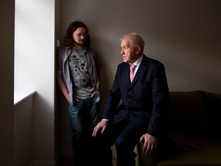 Minister Deenihan talking to artist Paul Quast, who has received a subsidised apartment in John's Square in Limerick city