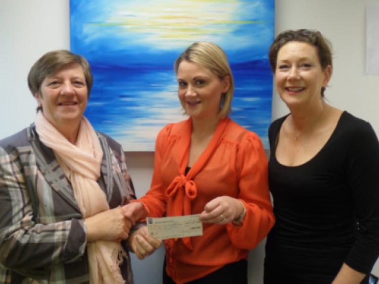 Jessie Griffin, Bruree, hands a cheque to Catheriona Mulcahy and Maeve McSweeney
