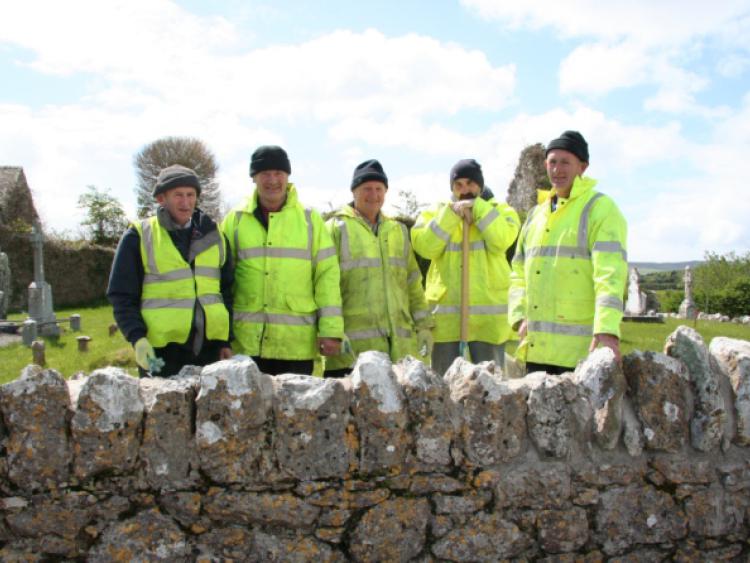 Tom Lenihan, Michael Barry, John Collum, George Simpson and Seamus Lenihan taking part in the lime mortar training course at Mungret cemetery