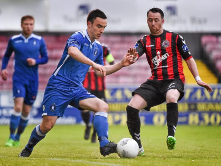 Limerick FC's Shane Tracy shows a neat touch against Paddy Kavanagh, of Bohemians, in their SSE Airtricity League Premier Division tie at Dalymount Park on Friday night