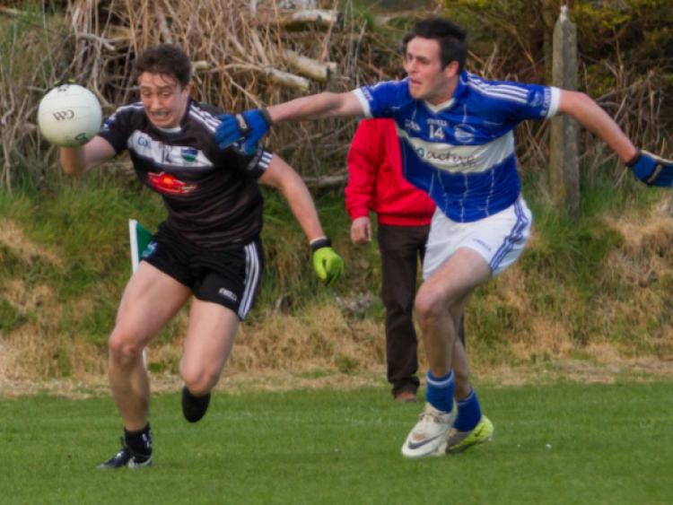 Cian Sheehan, Newcastle West, takes on Maurice Gleeson, Fr. Caseys during their Limerick SFC round one tie