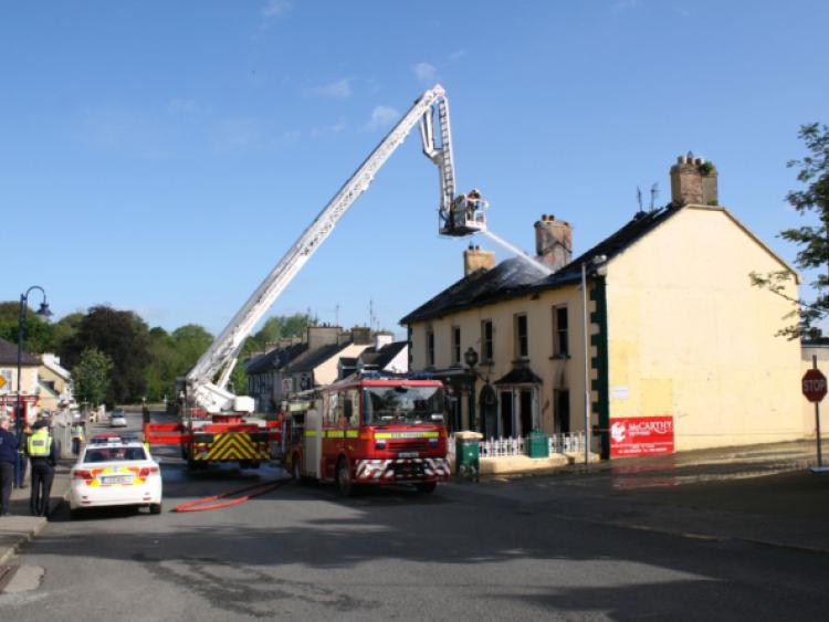 Heads for heights: Fire crews from Limerick city and Cappamore battled the fire in Worrall's Inn on Castleconnells Main Street for hours. Picture: Press 22