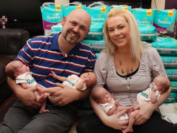 Each once more gorgeous than the next: Amelia, Lucas, Mollie and Lily with mum and dad, James and Grace. Picture: Michael Cowhey