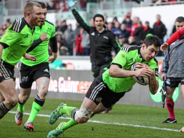 Munster's Felix Jones dives over to score his side's second try in their dramatic draw with the Scarlets in their Guinness PRO12 clash at Parc y Scarlets