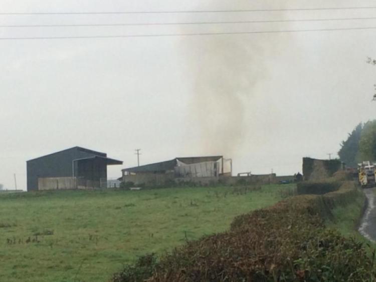 The scene from the roadside at the latest hay barn fire at Ballyvalode, Oola       Picture: Michael Cowhey