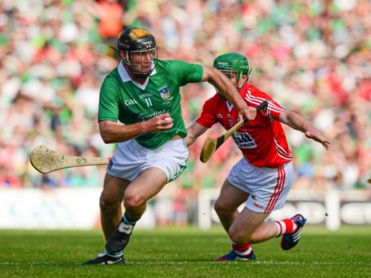 James Ryan, who scored three points from play, races away from Daniel Kearney, Cork, in the Munster senior hurling final at the Gaelic Grounds