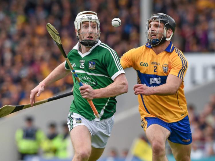 Cian Lynch, Limerick, in action against Domhnall O'Donovan, Clare during the Munster SHC
