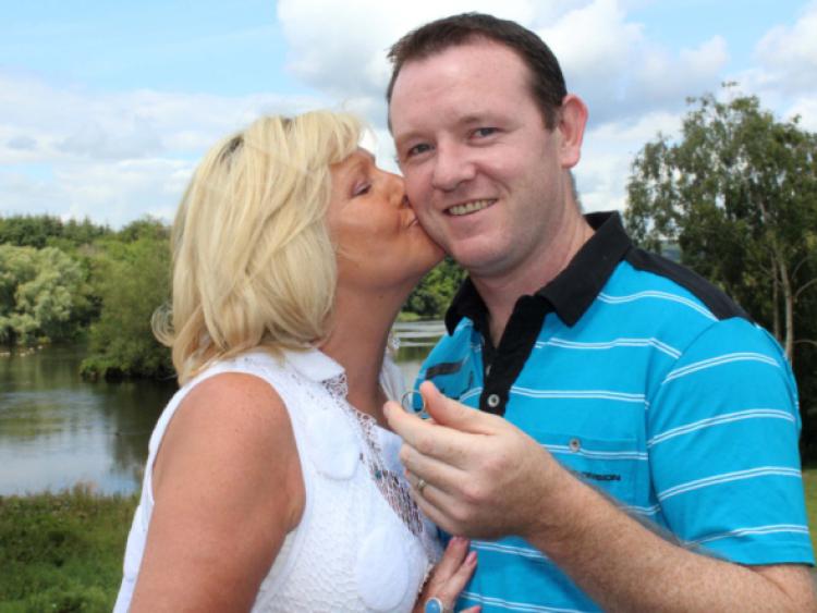 Alice Lillil gives John Kenneally a kiss after he returned her wedding ring, which she lost in April [Picture: Michael Cowhey]