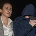 Garda Gráinne McLoone and Garda Patrick Kelly accompany