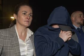Garda Gráinne McLoone and Garda Patrick Kelly accompany