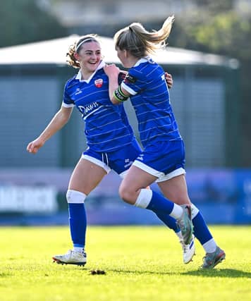 Kate Jones and Katie Lawlee celebrate their side's third goal against Waterford at the Markets Field last weekend, scored by Jones I PICTURE: Sportsfile