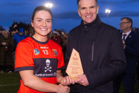 UCCs Sarah O’Brien, of Templeglantine and Limerick, receives the Player of the Match award from Pat Fenlon, Electric Ireland, after Sunday's Ashbourne Cup final | PICTURE: ©INPHO/Tom O’Hanlon