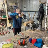 Drill, baby drill! Mark Ryan, 13, hard at work in his carpentry shed making the unique reindeer he sells at Christmas with his friend Jack Byrnes
