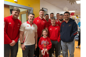 Sofia Hennebry from Ballyneety, was fittingly decked out in red when she met the Munster rugby team this week on their visit to the Children’s Ark at UHL