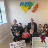 Pictured with children from Tara House, Clarina are Owen O'Sullivan and Treasa McAuliffe, the chief executive of St. Gabriel's