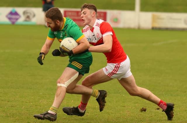 Mungret St Paul's midfielder Jack McCarthy puts St Kieran's corner back Mossie Shine under pressure in round five of the Limerick Senior Football Championship I PICTURE: Brendan Gleeson