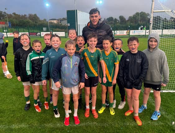 David Clifford pictured with members of the Ahane U9/U10 teams I PICTURE: Ahane GAA