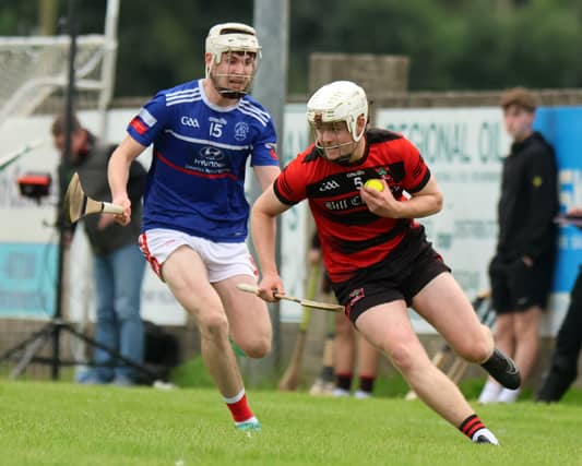 Adare's John MacSweeney in action against Mungret St Paul's Mark O'Brien, PICTURE: Brendan Gleeson