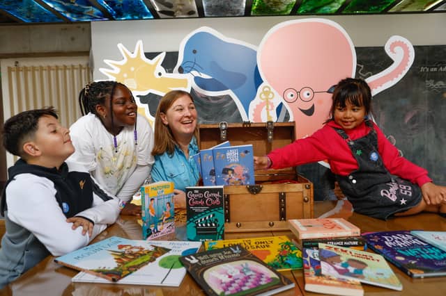 Elaina Ryan, CEO of Children's Books Ireland celebrating the launch of the reading guide with William, 9, Grace, 8, and Gian, 8 I PICTURE: