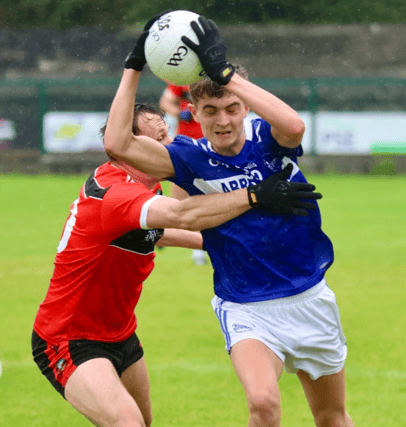 Danny McCarthy of Fr Casey's in action against Davy Lyons of Adare during the Limerick SFC, PICTURE: Brendan Gleeson