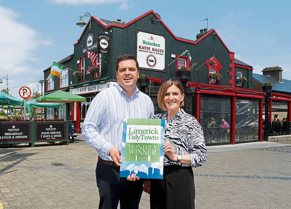 Maura O'Neill, Limerick City Tidy Towns presenting the group’s bi-monthly award to Tony Costello of Katie Daly's pub | PICTURE: Adrian Butler