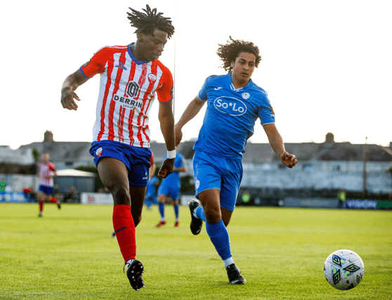 Darren Nwankwo, of Treaty United, in action against Filip Fjeldheim Da Silva, of Finn Harps, during their First Division meeting at the Markets Field in 2023