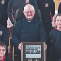 When Caherline NS pupils heard Fr Pat Currivan lost his All-Ireland medals, the children fundraised, got new ones specially made, and surprised him with the gift