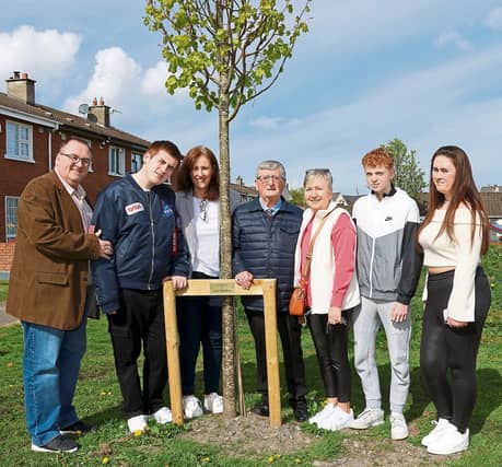 Anthony, Killian, Sinead and Tony Sheehan, Debbie and Aodhan Wallace with Kara Sheehan, standing by a memorial for Ann Sheehan, a real community champion in Thomondgate | PICTURE: Adrian Butler