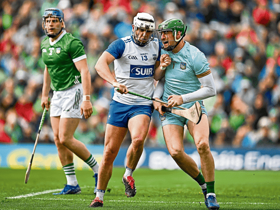 Limerick goalkeeper Nickie Quaid collides with Dessie Hutchinson, of Waterford, during their 2024 Munster senior hurling round robin fixture at the TUS Gaelic Grounds