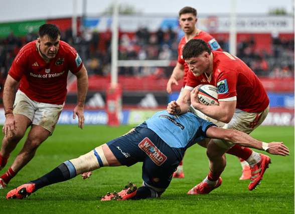 Jack O'Donoghue, of Munster Rugby, is tackled by Ruan Nortje, of Vodacom Bulls, during the URC fixture at Thomond Park on Easter Saturday | PICTURE: Sportsfile