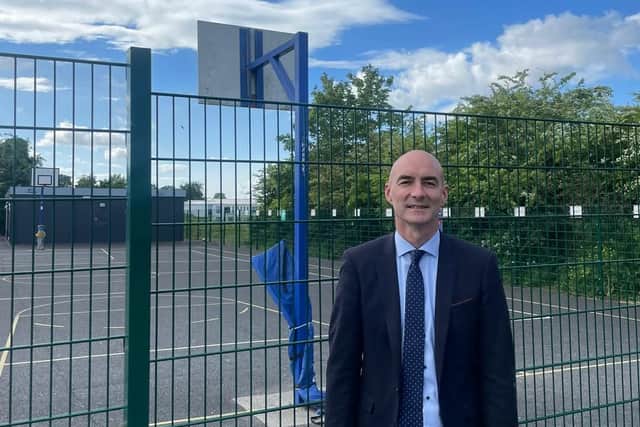 Local councillor Daniel Butler, pictured below outside the basketball court, says one of the courts will be open, while outstanding works are done in the other.