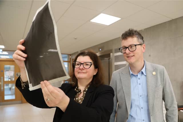 Dr Anne Beaucamp McLoughlin and Professor Maurice N Collins inspect a sheet of carbon fibre at the research project launch