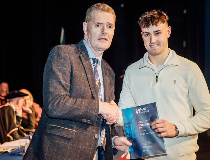 Vince Harrington of Na Piarsaigh alongside Tim Murphy of Munster GAA