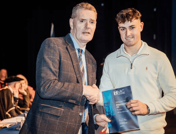 Vince Harrington of Na Piarsaigh alongside Tim Murphy of Munster GAA