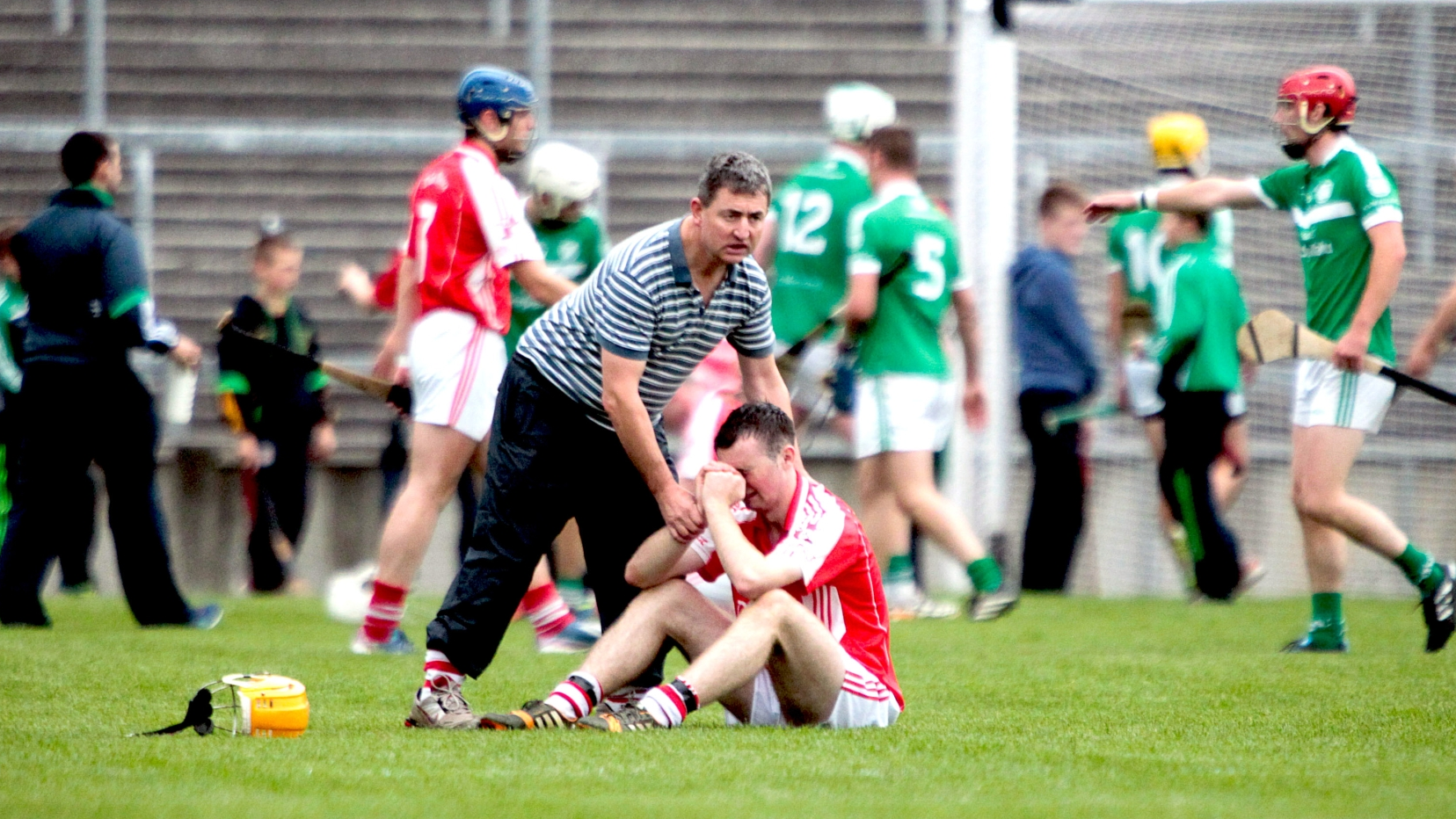 Manager Gerdie McGrath consoles Doon player Richie English after their Limerick senior hurling semi-final defeat to Kilmallock at the TUS Gaelic Grounds  in 2014 l PICTURE: Keith Wiseman