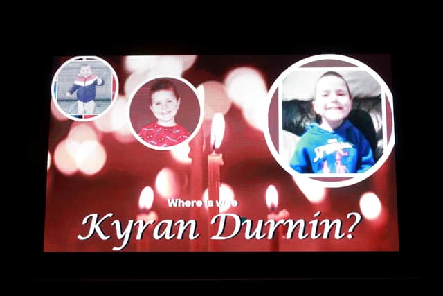 Dozens of local people congregated for the vigil in the Co Louth town, with some placing lit candles beneath a large advertising screen that displayed a picture collage of Kyran along with the message “Where is wee Kyran Durnin?”
