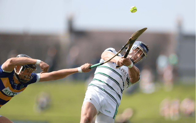 Jack Quaid, of Effin, strikes the ball despite an attempted block from Daithi Heffernan, of Blackrock, in their Premier IHC group game in Kilmallock on Saturday | PICTURE: Keith Wiseman