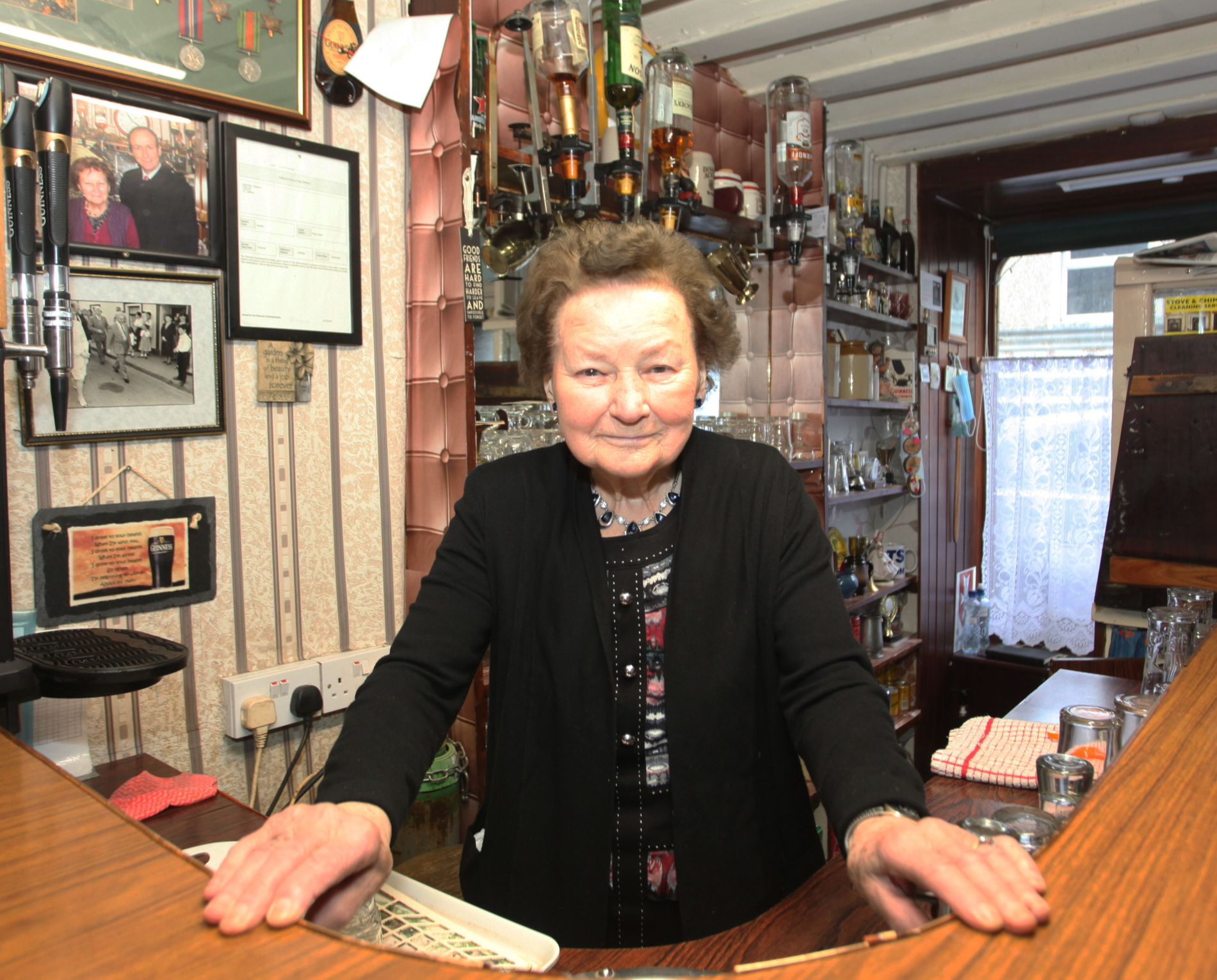 The late Peg Carmody behind the bar in Hospital in 2022 I PICTURE: Brendan Gleeson