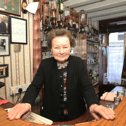 The late Peg Carmody behind the bar in Hospital in 2022 I PICTURE: Brendan Gleeson