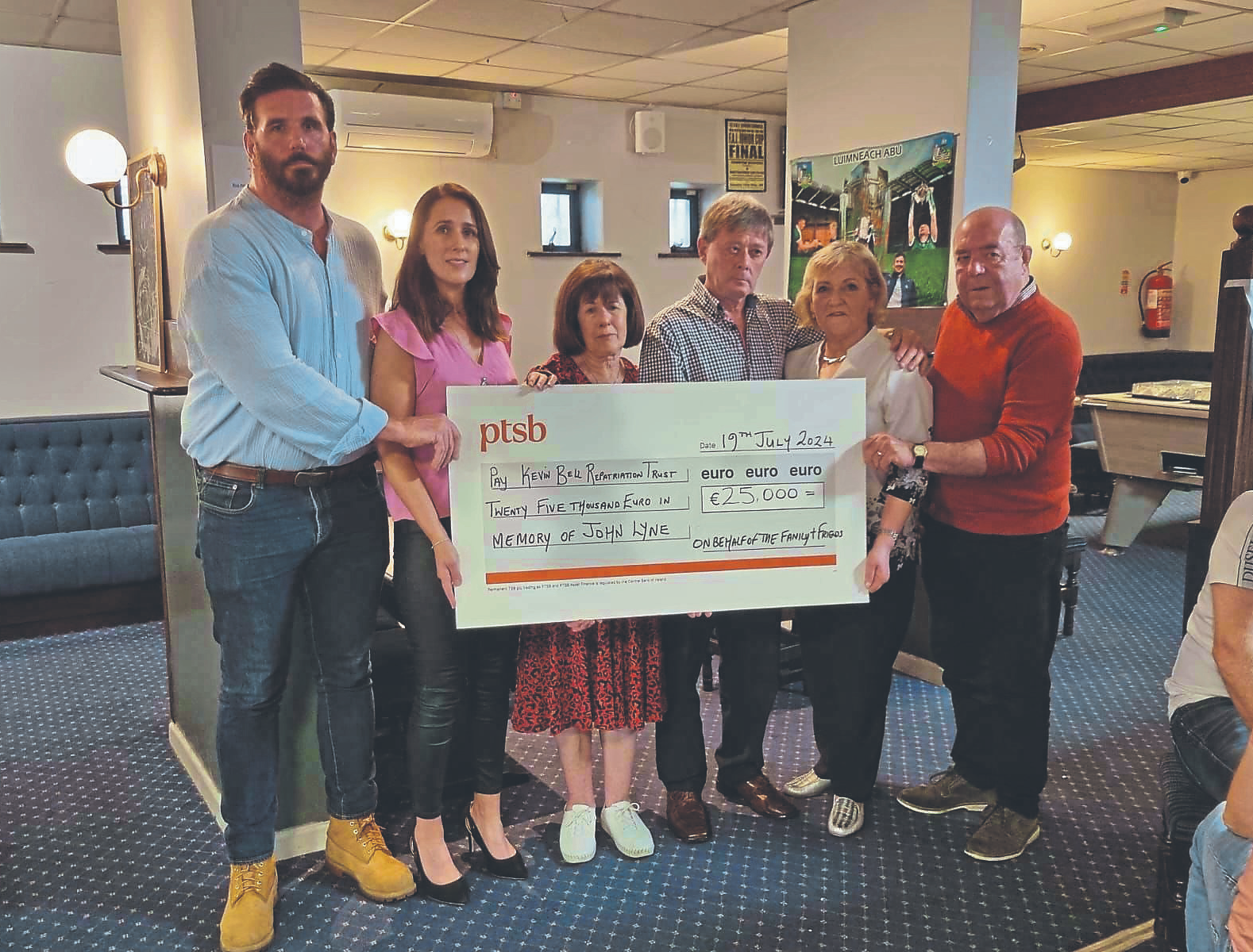 The late John Lyne’s brother-in-law and sister, Ken and Claire Greaney, parents Pat and Theresa Lyne, Eithne and Colin Bell, of the Kevin Bell Repatriation Trust, at the cheque presentation of €25k