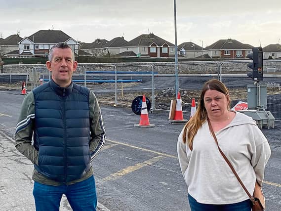 Maurice Quinlivan and local Sinn Fein councillor Sharon Benson at a stalled section of the Coonagh to Knockalisheen Road