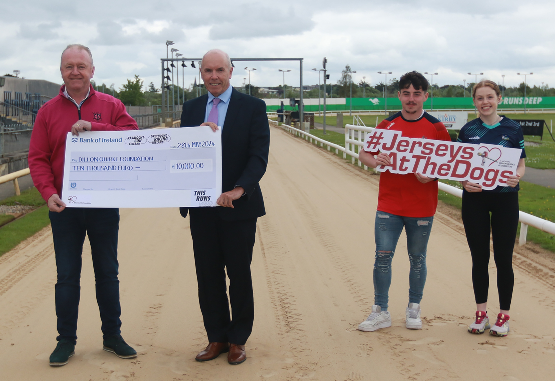 Tim Lucey, CEO Greyhound Racing Ireland, presents Dan Quirke, Founder Dillon Quirke Foundation with a cheque of €10,000 raised at the Jerseys At The Dogs Nationwide Bucket Collection