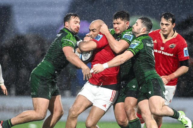 Simon Zebo of Munster is tackled by Connacht players, from left, Shayne Bolton, Dave Heffernan and Caolin Blade in the URC game on New Years Day 2024 | PICTURE: Sportsfile