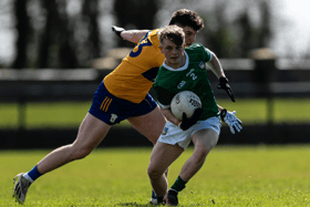 Limerick's Craig O'Connell is closed down by Clare's Conor Fennell in their eirgrid Munster U20 football championship fixture at Ballyagran on Saturday | PICTURE: Tom Beary