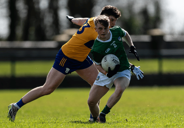 Limerick's Craig O'Connell is closed down by Clare's Conor Fennell in their eirgrid Munster U20 football championship fixture at Ballyagran on Saturday | PICTURE: Tom Beary