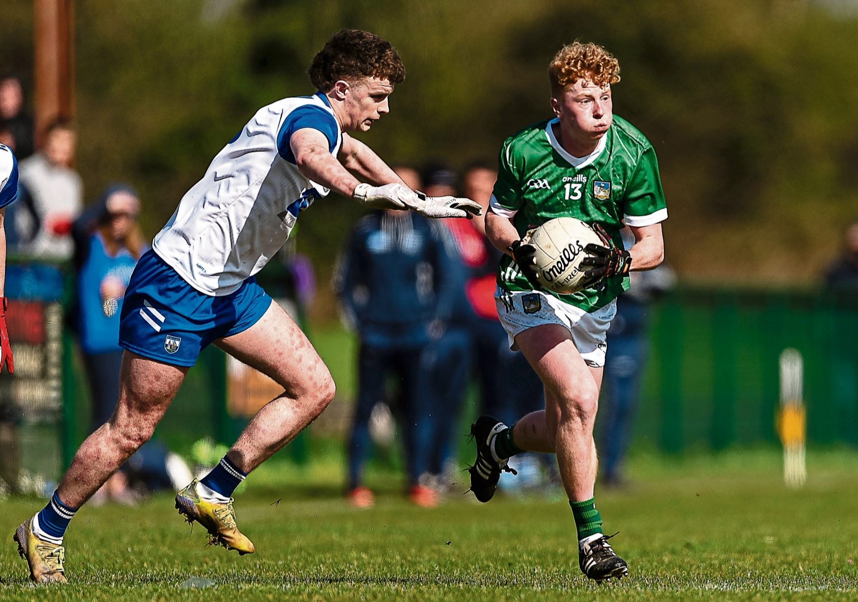 Limerick's Diarmuid Hynes is tackled by Calum Sloan, of Waterford, during the EirGrid Munster U-20 Football Championship fixture at Ballyagran on Saturday last | PICTURE: Tom Beary