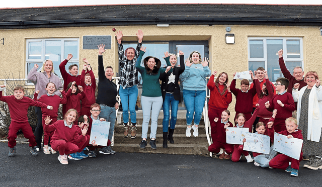 Principal Ciara Sheehy and Michael Sheahan, chairperson of the board of management at Bohermore NS with teachers, pupils and past students who are taking part in the skydive PICTURE: Adrian Butler