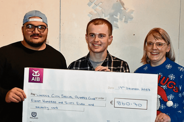 Ian, presenting the cheque to Limerick City Special Olympics, alongside his mother, Ciara